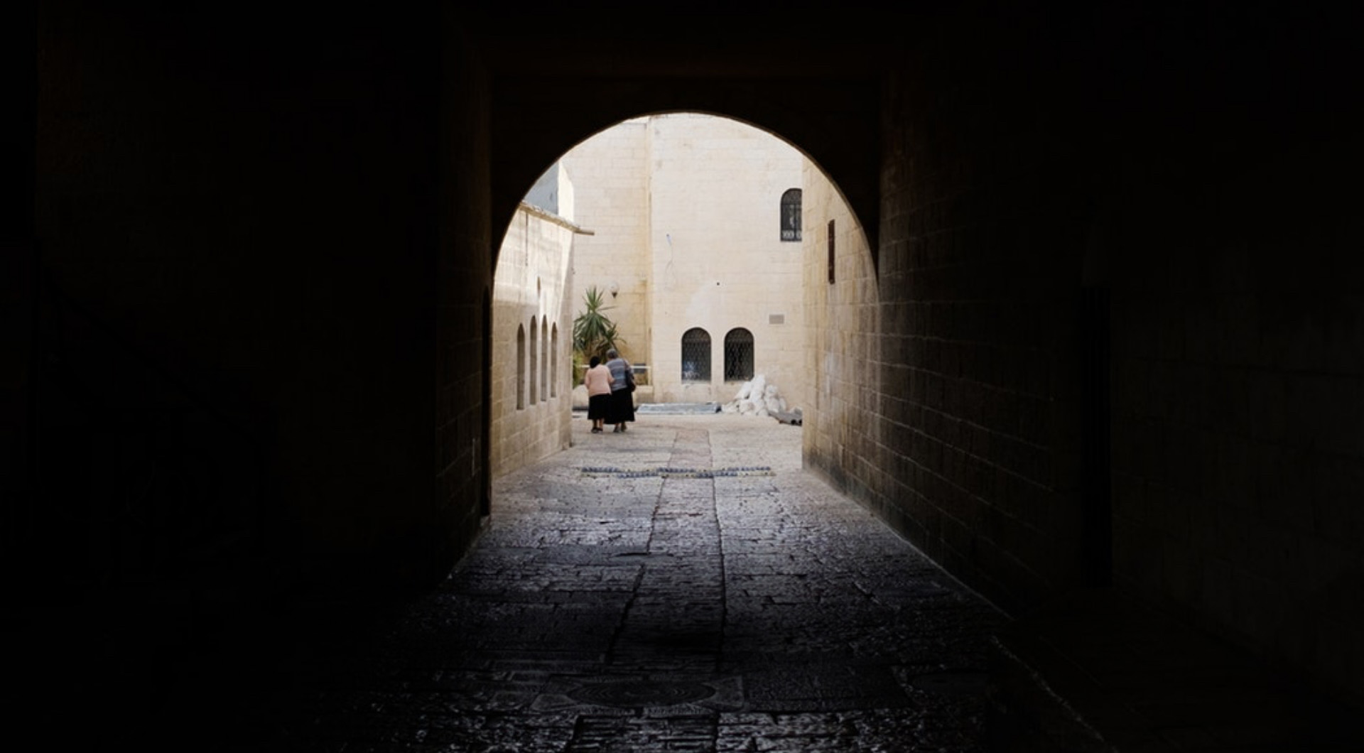 Two people walking on the street